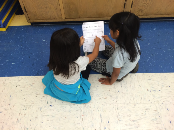 Two young students talking about a story plan