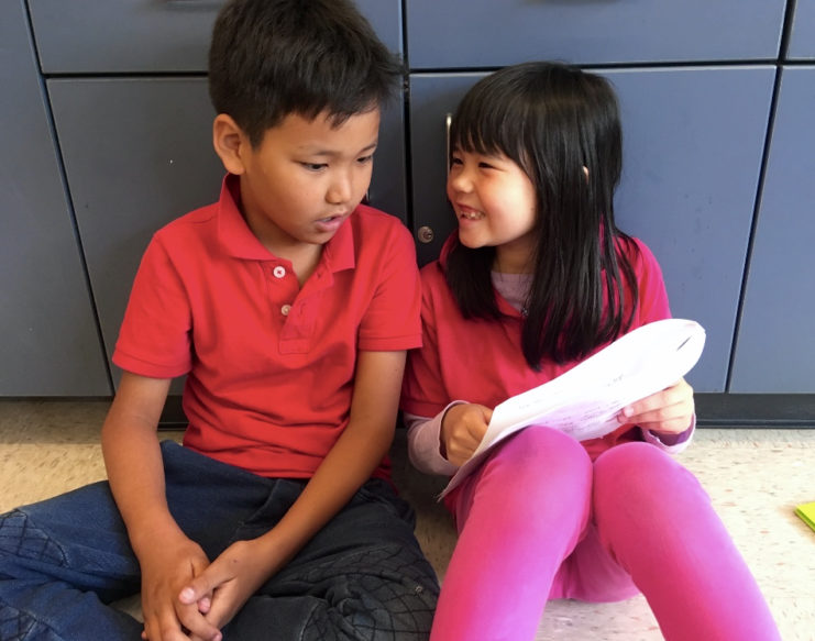 Two students talking about writing