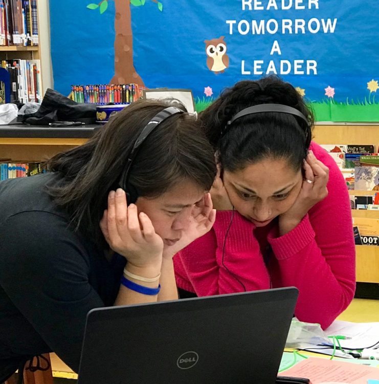 Teachers looking at video data together